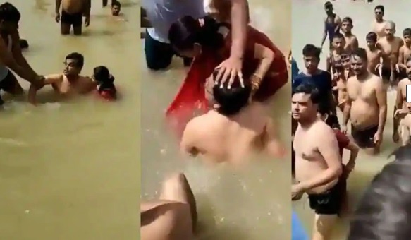سریو ندی میں ڈوبکی لگانے کے دوران میاں بیوی نے ایک دوسرے کو کیا بوسہ، لوگوں نے کردی پٹائی